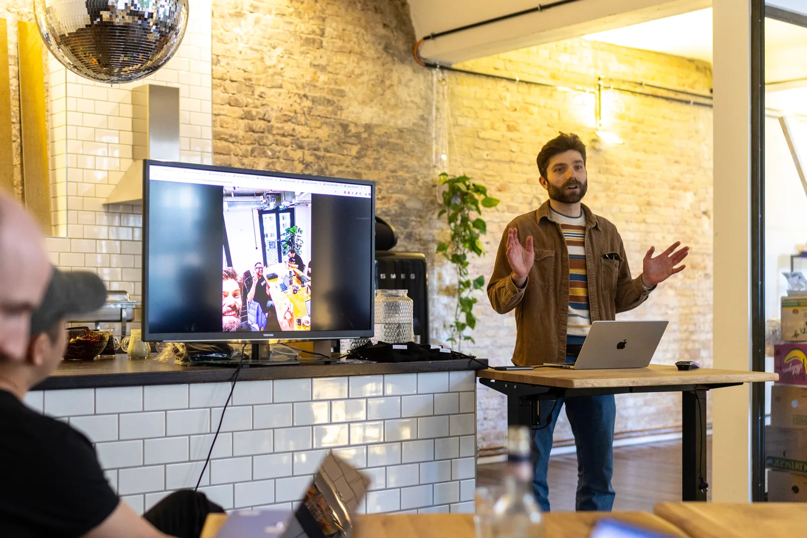 A live AI demo beneath the disco ball at Futura House